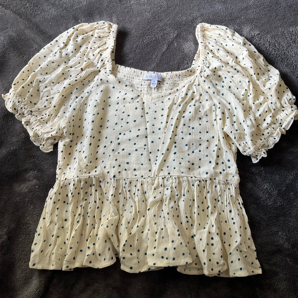 cream top with ruffles and puff sleeves